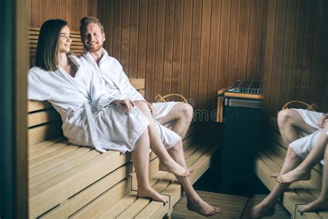 Young Happy Couple Relaxing Inside A Sauna At Spa Resort Hotel Luxury