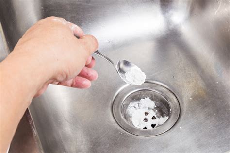 baking soda poured  unclog drainage system  home stock photo