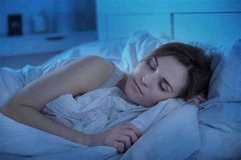 Girl Peacefully Sleeping In Bed At Night – Nurse Advisor Magazine