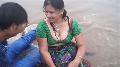 aunty hot wet saree at beach huge cleavage and navel expose