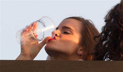 Emma Watson Downs A Pint Of Beer As She Enjoys Taylor Swift Gig With