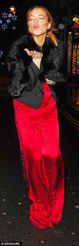 lindsay lohan wears satin jumpsuit to party with her sister ali daily mail online