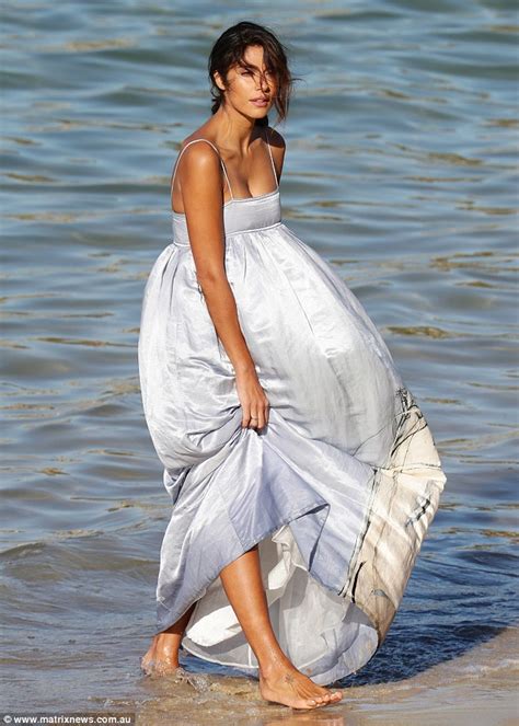 pia miller stuns in a billowing dress during a beachside photoshoot