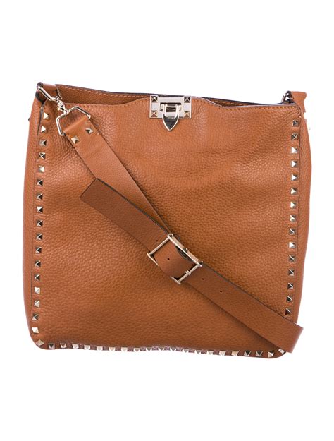valentino rockstud crossbody bag neutrals crossbody bags handbags val  realreal