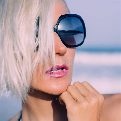 Stylish Blonde Vacation In Fashionable Sunglasses On The Beach Stock
