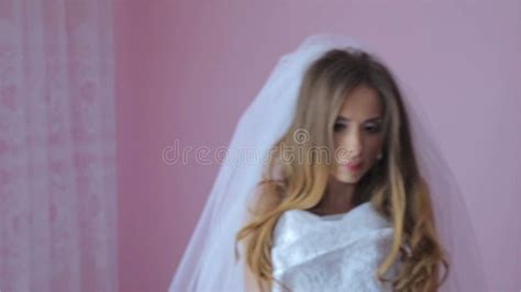 Beautiful And Girl Tries On A Wedding Dress Stock Video Video Of