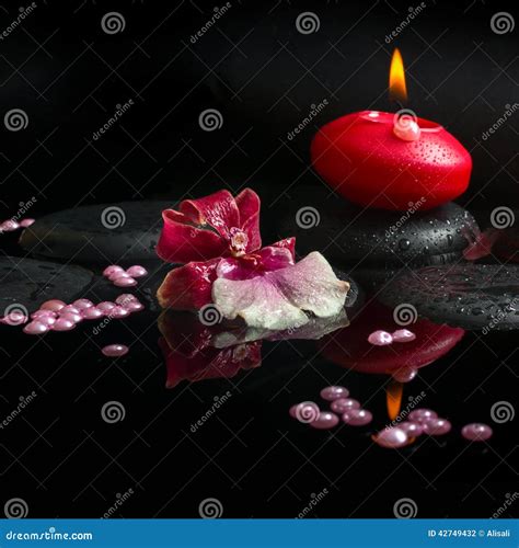 spa concept  white  red orchid cambria red candle stock photo