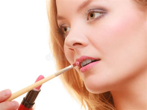 Part Of Face Woman Applying Pink Lipstick With Brush Stock Image