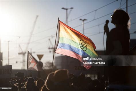 A Woman Stands Near Altered By Antifa Rainbow Flag During Pro Choice