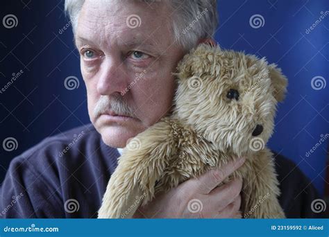senior holding teddy bear stock photography image