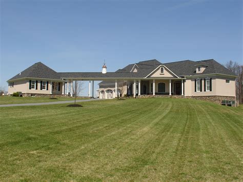 front view custom rancher   law suite  stucco  stone custom home builders custom