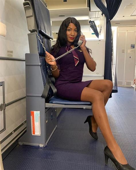 Image May Contain 1 Person Sitting And Indoor Sexy Flight Attendant