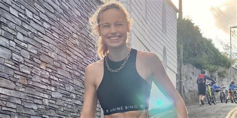 brie larson flashes killer abs in a black workout set on