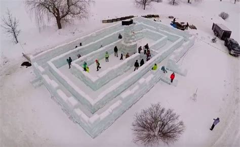 aerial view  people standing   middle   large maze  snow covered ground