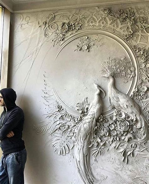 intricate bas relief sculpture resembles intricate impressionist paintings