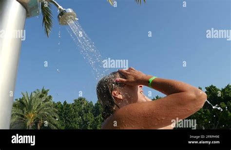 beautiful woman taking outdoor shower slow motion stock video footage
