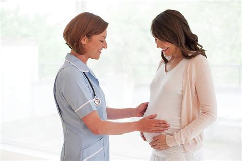 Pregnant Woman And Nurse Photograph By Ian Hooton Science Photo Library