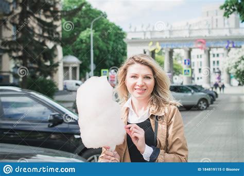 Young Happy Hipster Woman Eating Sweetened Cotton Candy Stock Image