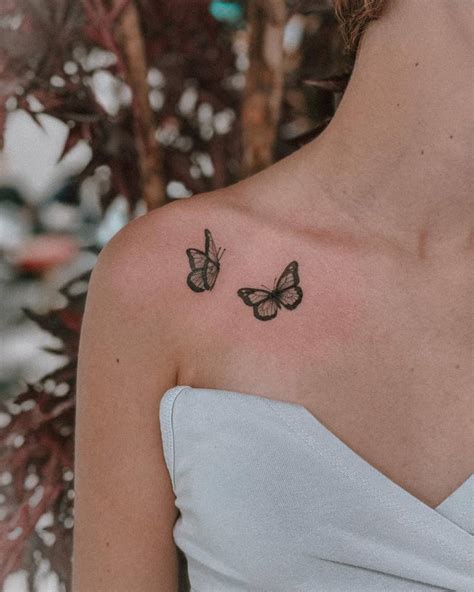 Butterfly Couple Tattoo Located On The Collarbone