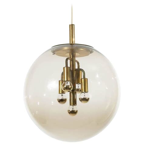 Large Limburg Pendant Light Brass And Amber Glass Globe