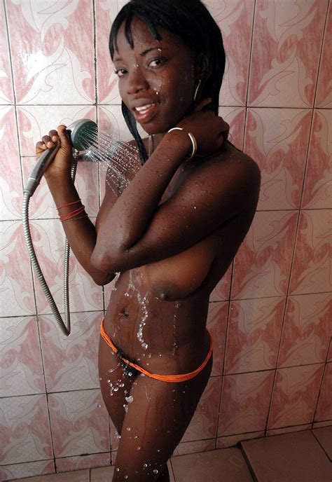 skinny ebony girl having shower in bathroom hood tube