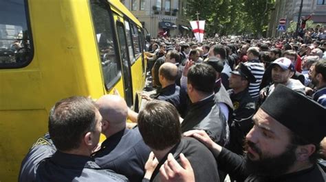 thousands protest in georgia over gay rights rally bbc news