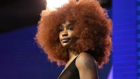 black celebrities rocking bold red hair essence