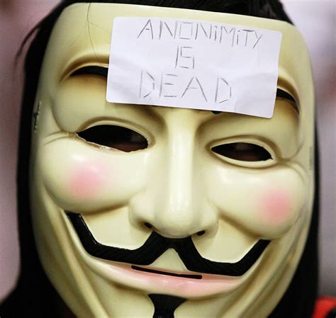 masked anonymous protesters aid time warner s profits the new york times