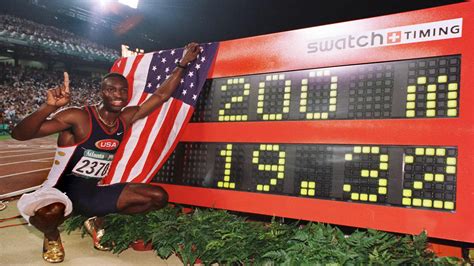 Michael Johnson Poses With The Timer After He Set A 200m World Record