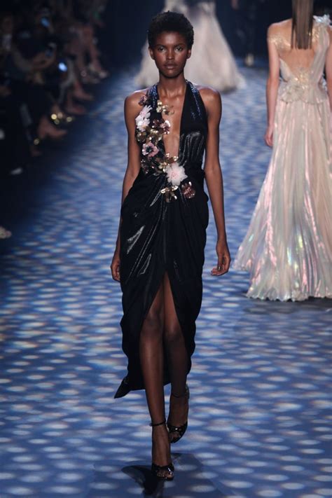 a model walked the runway wearing the marchesa look at nyfw on sept