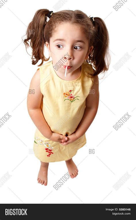 cute girl sucking on lollipop candy image and photo bigstock