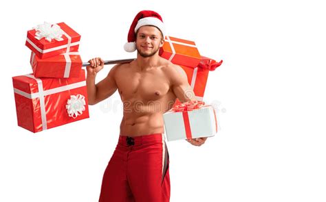 ripped santa claus holding barbell and giving presents