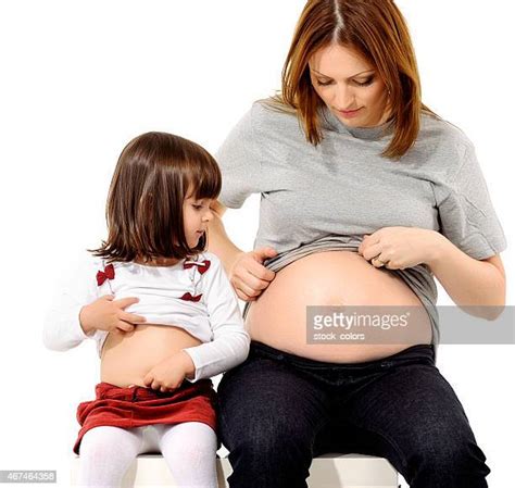 pregnant mother and daughter showing their belly photos and premium
