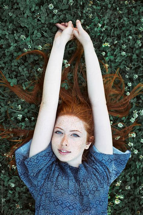 beautiful redhead with freckles by stocksy contributor maja topcagic