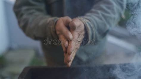 Homeless Man Warming His Hands By A Fire Poor Men Warm Outdoors Near