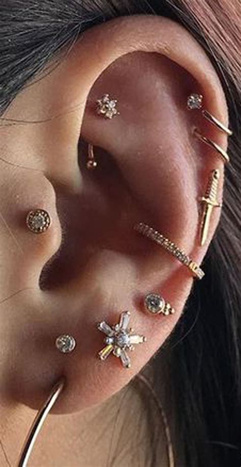cute multiple ear piercing ideas  women flower rook jewelry conch