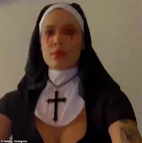 halsey flashes cleavage as a sexy nun while camila and