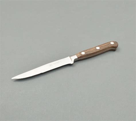 forget steak knife wenge wood handled  sharp point   sharped serrated blade due