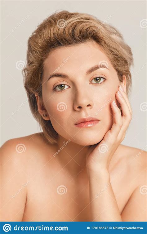 Short Haired Blonde With Green Eyes Looking At The Camera Stock Image