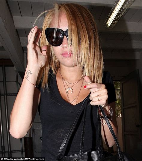 miley cyrus lets her blonde hair down to debut new razor