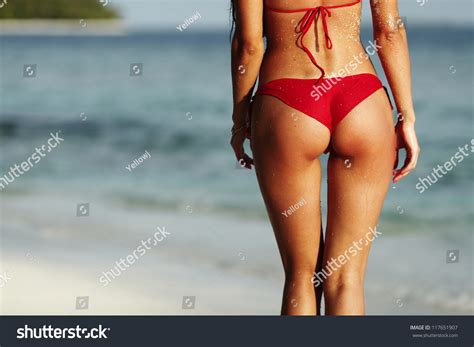 Sexy Back Of A Beautiful Woman In Red Bikini On Sea Background Stock