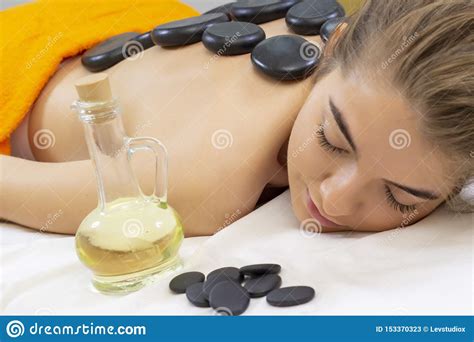 spa hot stone massage professional beautician massaging