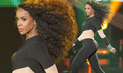 kelly rowland shows off a very rounded posterior in skintight catsuit
