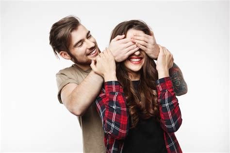free photo guy covering woman s eyes to surprise her