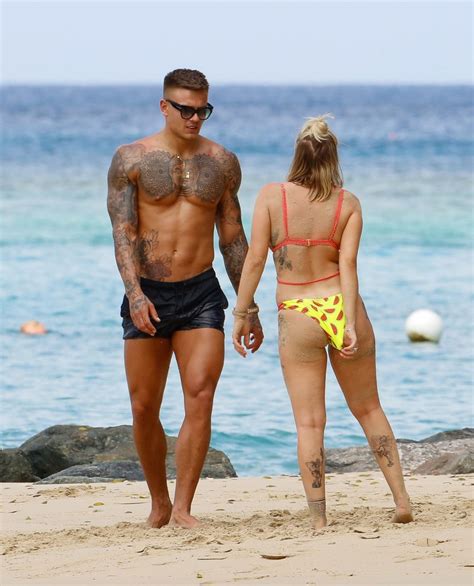 olivia buckland displays her tattooed body in barbados 29 photos