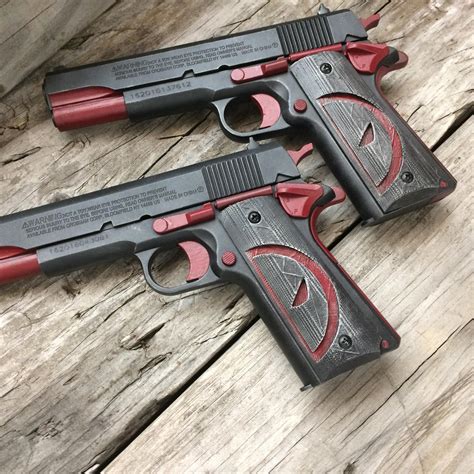 dual deadpool themed pistols   opinions rdeadpool