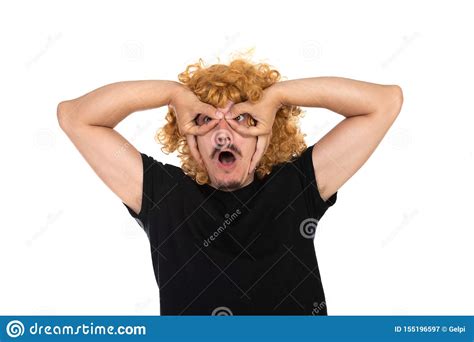 Man With A Mustache Wearing A Woman`s Wig Stock Image