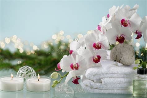 christmas spa decorations  blue background  orchid candles