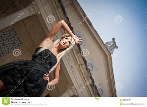 beautiful woman in black dress posing outdoor sexy woman in stylish retro scene elegant woman