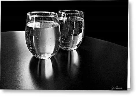 water glasses in black and white photograph by joe bonita